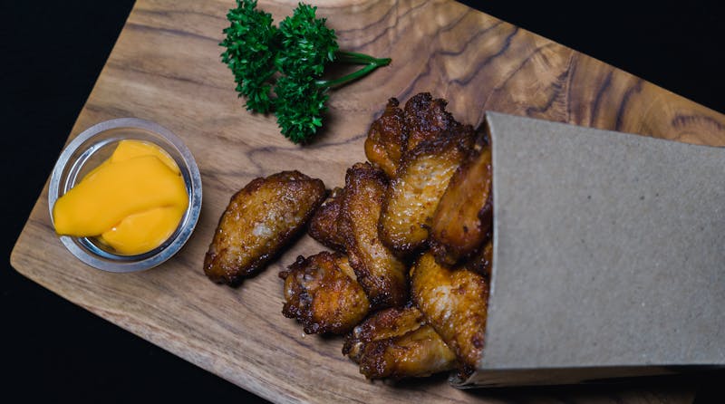 Wings over Corn on the Cob grilled sweet corn with seasoned butter